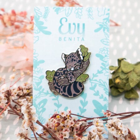 A sleepy clouded leopard enamel pin badge by Evy Benita.