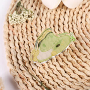 An acrylic keychain depicting a cute cartoon bird. The bird is inspired by the Wood Warbler.